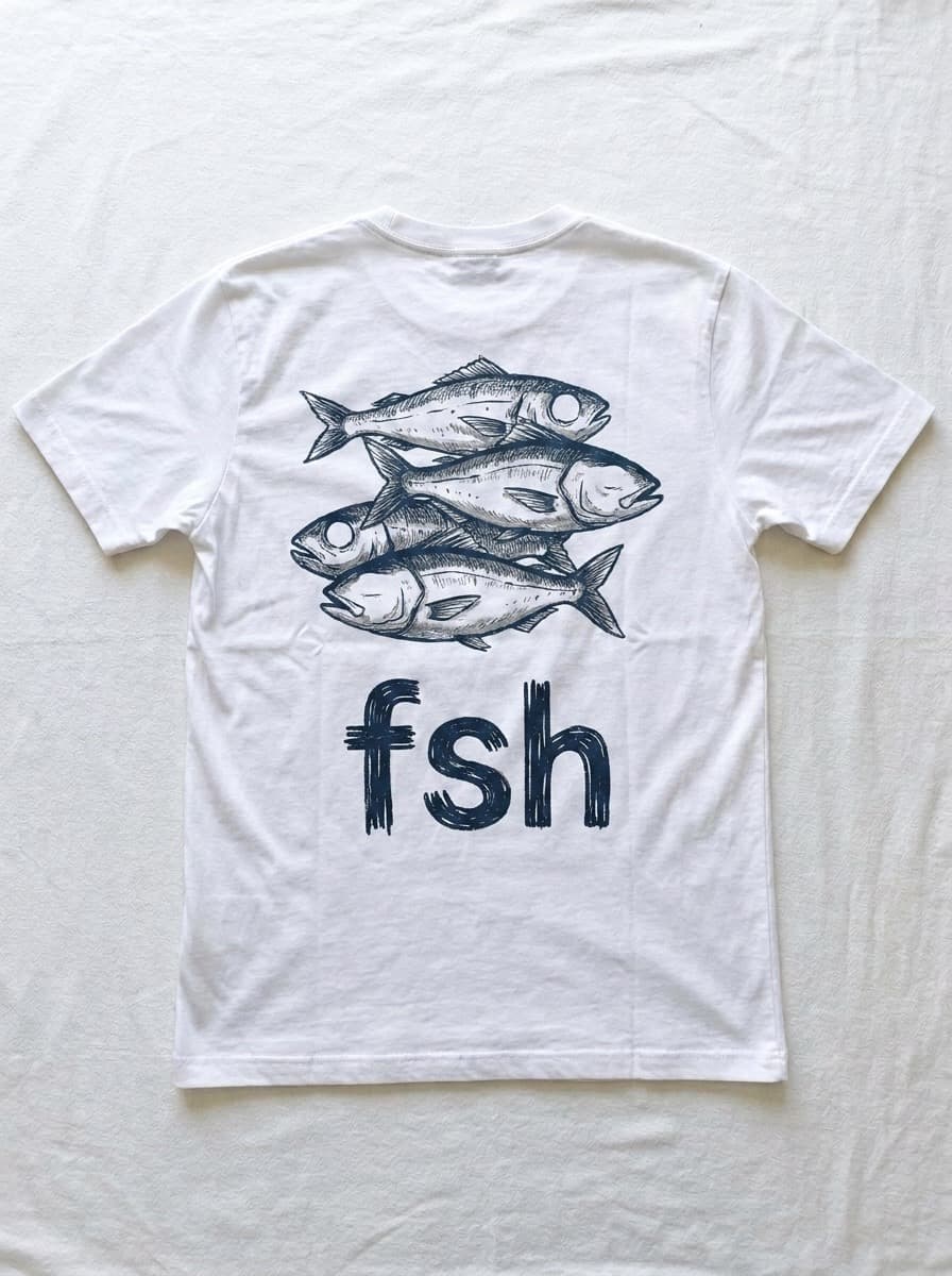 Back of a white t-shirt printed with a navy ink drawing of three fish above the lowercase letters f s h.