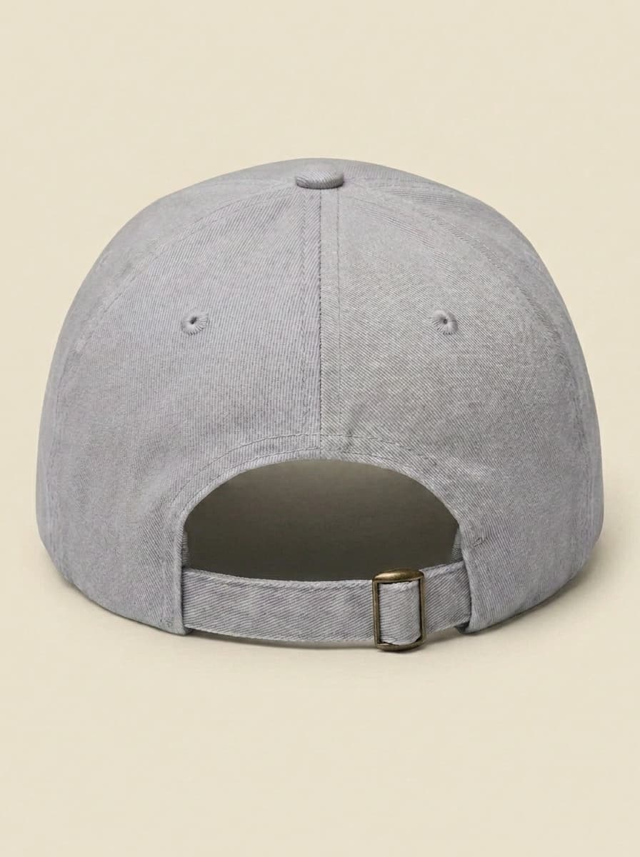 Back of the light grey STILL RENTING hat, showing the adjustable strap.
